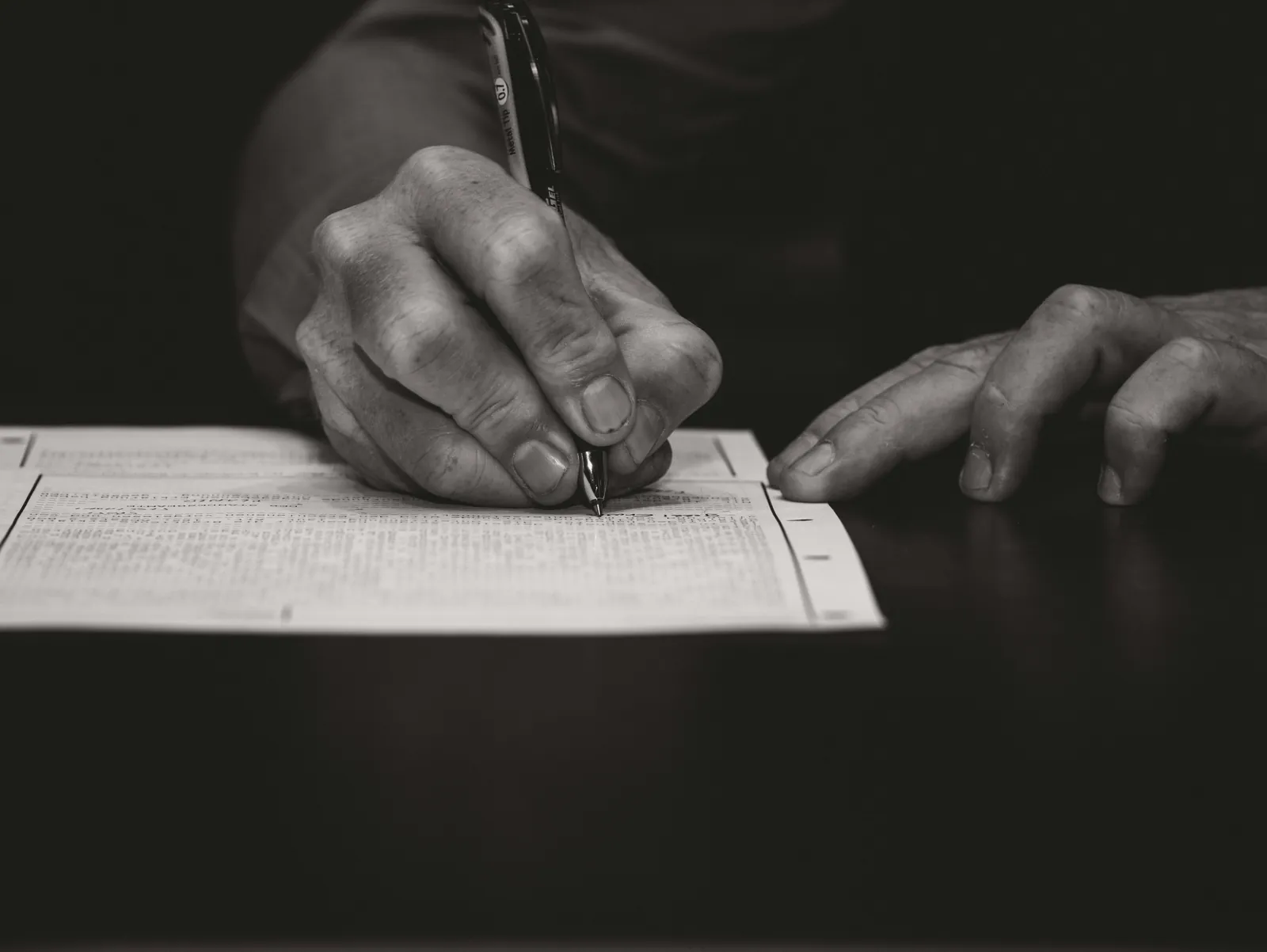 Hand signing a licence application form
